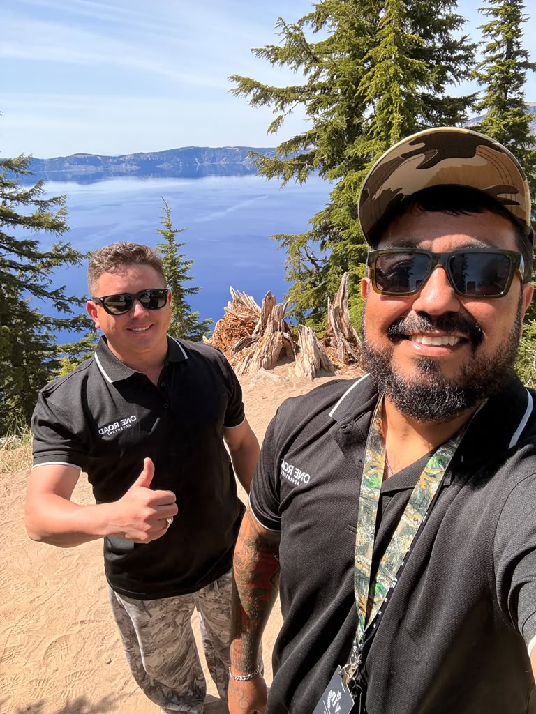 Celso and Fábio together, wearing One Road Adventure polos.